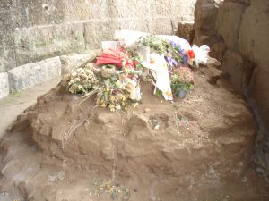 Remains of the Temple of the Divine Julius, with flowers left in his honor
